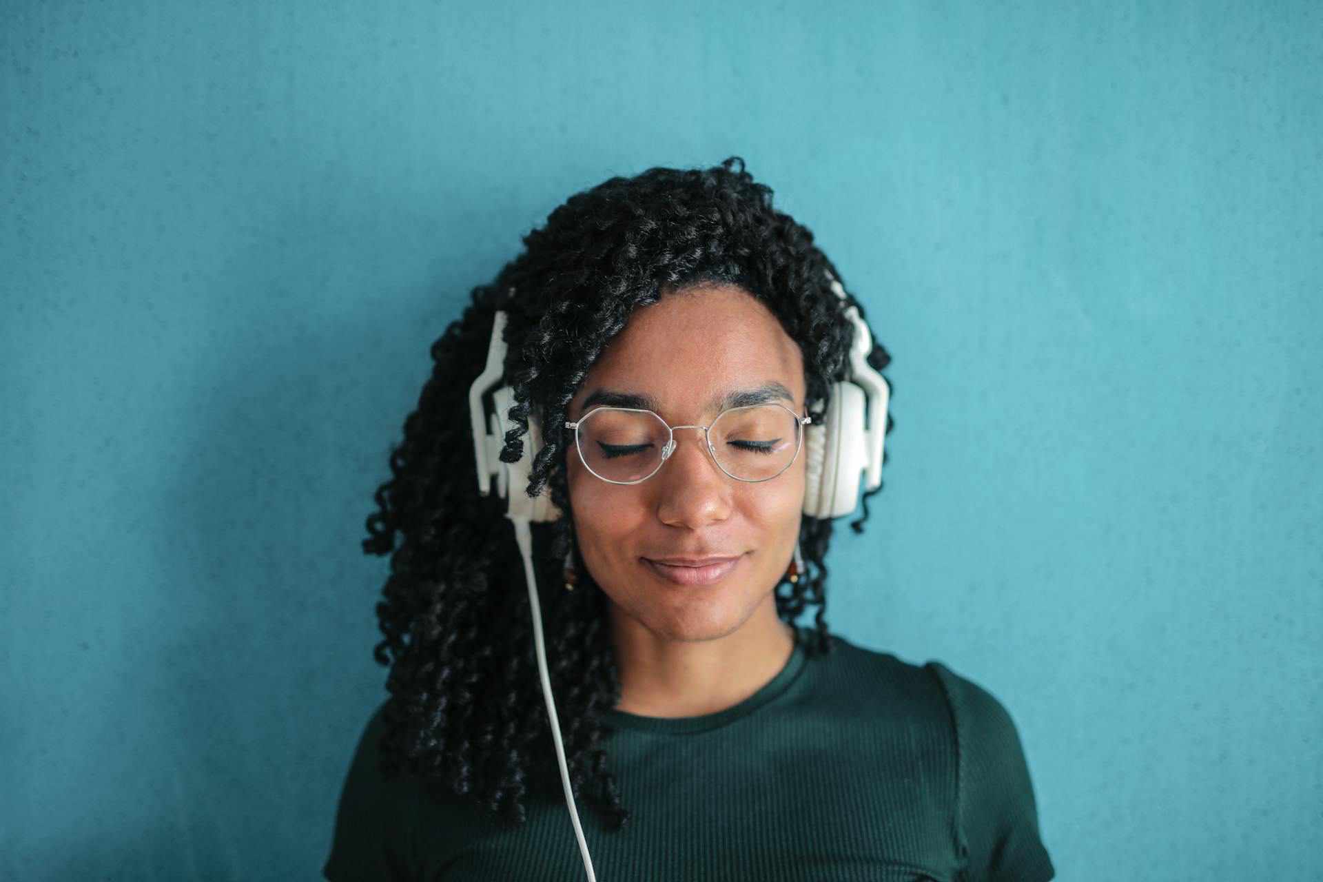 african american female with headphones listening to you